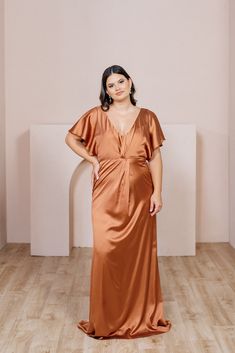 When you want a dress that offers more coverage but is still fresh and youthful, our graceful Gwen dress is the perfect solution. Gwen has delicate flutter sleeves and a V-neckline with built-in bra cups. The twist detail in the front makes this dress elegant and sophisticated. Wedding Parties Colors, Orange Bridesmaid Dresses, Modest Style, Bridesmaid Dress Colors, Long Bridesmaid Dress, Satin Bridesmaid Dresses, Sparkle Dress, Dress Gift, Mermaid Dresses