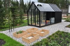 a small black house with lots of windows