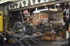 a garage filled with lots of different types of motorcycles