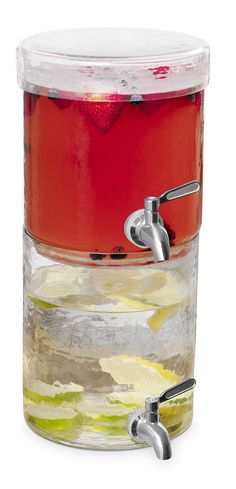 a glass container filled with liquid and fruit