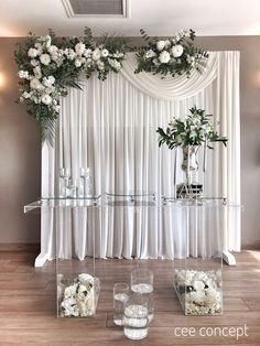 an elegant wedding setup with white flowers and greenery