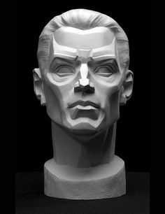 a white sculpture of a man's head on a black background