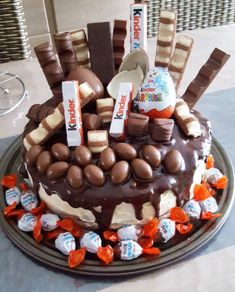 a chocolate cake with marshmallows and candies on top