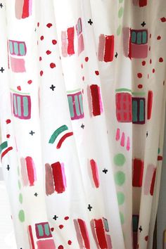 a curtain with red and green designs on it