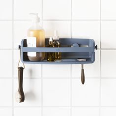 a bathroom shelf with soap, toothbrushes and other items