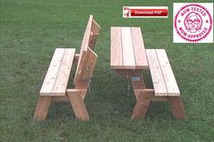 a wooden picnic table and two benches in the grass with an award sticker above it