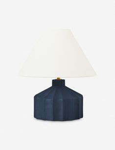 a blue table lamp with a white shade