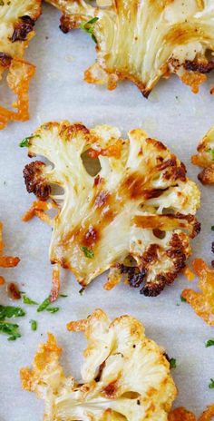 roasted cauliflower florets with parsley on the top and green sprouts in the middle