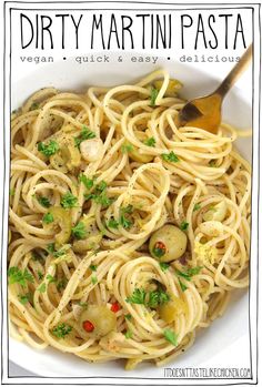 a white bowl filled with pasta and vegetables