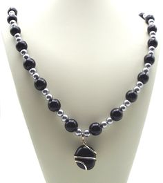 "28\" long beaded necklace       Black and silver glass beads      Beautiful wrapped black agate pendant  Makes an elegant statement to dress up your outfit Necklace clasp is an \"easy to open and close by yourself\" toggle clasp Ships next business day!" Silver And Black Necklace, Silver Onyx Beaded Necklace With Black Beads, Beaded Necklace Black, Gray Beaded Necklace, Black Pendant Necklace, Diy Jewellery Designs, Necklace Clasp, Diy Pendant Necklace, Beaded Necklace Diy