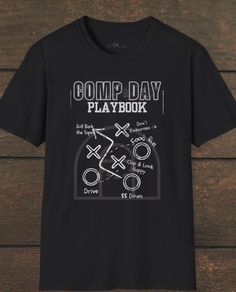 a black t - shirt with the words comp day playbook written on it