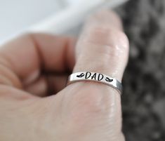 This listing comes with one personalized name memorial ring. These rings are 3mm wide. They are composed of silver pewter and are non-tarnishing and hypoallergenic. Pewter is lightweight and incredibly comfortable. ♥ Your purchase will arrive in an organza bag nestled inside a lovely cotton filled gift box wrapped with beautiful ribbon ready for gift giving. ♥ ~ Thank you for visiting my shop ~ ♥ Please remember, as with all hand stamped jewelry, the lettering may not always line up perfectly straight. Hand stamping is a very time consuming and tedious process. Every letter is hand stamped, therefore, each letter or name may have slight variations in depth, alignment, and spacing. This should not be seen as a defect, but rather as charm and character added to your one-of-a-kind handcrafted Memorial Rings, Father Memorial, Ring Layering, Ring Name, Memorial Ring, Mom Ring, In Memory Of Dad, Name Ring, Cute Tattoos For Women