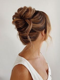 81 Gorgeous Wedding Updos for Brides With Long Hair Bridesmaid Hairstyles Bun Top Knot, Asymmetrical Updo Wedding, Maternity Updo Hairstyles, Bridal Updos For Round Faces, Wedding Updo With Fringe, Bridesmaid Hairstyles Dark Hair Updo, Retro Updo Wedding, Fancy Hair Updos Classy, Wedding Hair Updo Long Hair