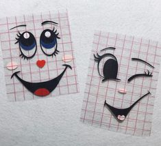 two pieces of paper that have been cut out to look like clowns with eyes and noses