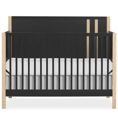 an image of a black crib with white sheets and wood trim on the sides