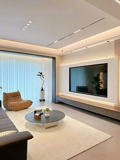 modern living room with large flat screen tv on the wall and white carpeted flooring