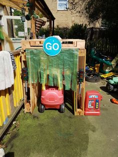 an outdoor play area with toys and other items