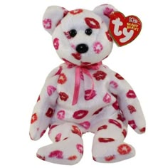 a white and red teddy bear with lipstick on it