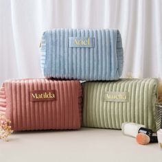 "Meet your new beauty sidekick - the Velvet Makeup Bag, the ultimate bridesmaid gift that's got glam and practicality on lock. Picture this: a touch of luxe velvet that's as soft as a cloud, coming in two sizes to match your daily hustle or jet-setting adventures. Crafted from sumptuous velvet, this makeup bag adds a dash of sophistication to your beauty routine. Its plush texture not only feels divine but also offers a chic storage solution for all your essentials.  Available in three gorgeous colors, there's a shade to suit every personality and style. These bags make a statement while keeping your beauty essentials organized. Treat your bridesmaids to a gift that's as beautiful as they are - our Velvet Makeup Bag is the epitome of practical luxury, making every makeup moment a delight. Cheap Clutch Cosmetic Bag For Gift, Cheap Blue Cosmetic Bag As Gift, Cheap Blue Cosmetic Bag For Gift, Cheap Casual Cosmetic Bag For Gift, Cheap Elegant Cosmetic Bag, Cheap Multicolor Cosmetic Bag Gift, Luxury Elegant Cosmetic Bag For Everyday, Cheap Gift Cosmetic Bag, Luxury Modern Cosmetic Bag With Multiple Compartments