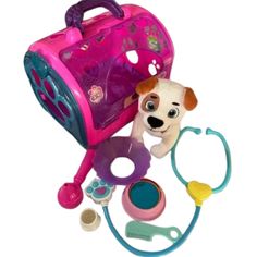 a toy with a dog inside of it next to a doctor's stethoscope