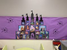 a purple wall with pictures on it in front of a green table and chairs near a yellow chair