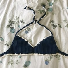 a navy blue crochet halter bralette with scoop neck and white icicle detailing. adjustable band and halter top. perfect for music festivals, sunbathing, or lounging around the house, you're sure to feel and look your best at any place and time in this comfortable bralette. ☆*ﾟﾟ･｡☆*ﾟﾟ･｡☆*ﾟﾟ･｡ ☆ size XS/S (fits cup size A-B, band size 30-34) ☆ made with 100% cotton yarn ☆ not intended for salt water or chlorine exposure ☆ hand wash only in cold water to avoid color transfer ☆ every item is handmad Navy Blue Crochet, Crochet Bra, Crochet Stitches Free, Crochet Bralette, Halter Bralette, Crochet Clothing And Accessories, Navy Blue Top, Crochet Halter, Blue Crochet