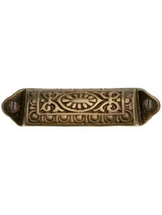 an antique brass door handle with ornate designs