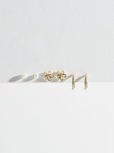 This set of earrings is the perfect, dainty set for any look! With pearl studs, sparkly flowers and delicate hoops, wear one pair at a time or mix and match! Gold Stud Earrings Set, Sparkly Flowers, Wedding Branding, Gift Inspiration, Gold Stud Earrings, Altard State, Plus Size Shopping, Gold Stud, Altar'd State