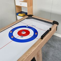 an air hockey table in the corner of a room