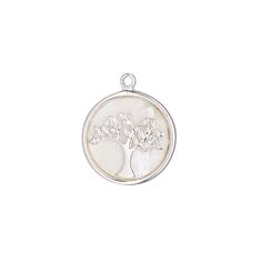 a silver pendant with a tree on it's side and leaves in the center