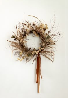 a dried wreath hanging on the wall