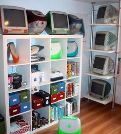 there are many computers on the shelves in this room