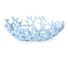 a blue coral shaped bowl sitting on top of a white table