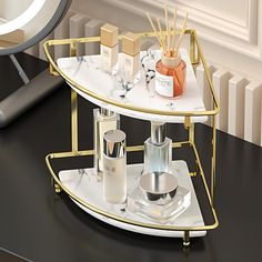 a gold and white shelf with cosmetics on it