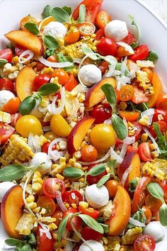 a white bowl filled with lots of different types of vegetables