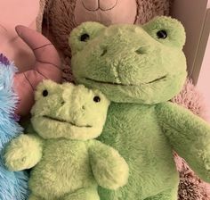 two stuffed animals sitting next to each other