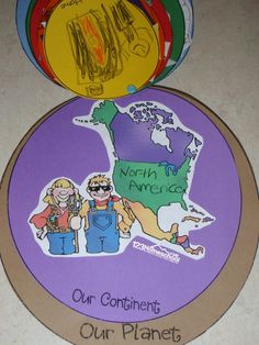 two children's magnets with the map of north america and our planet on them