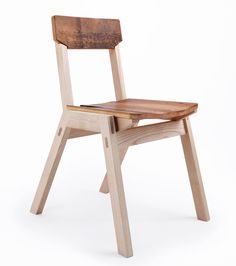 a wooden chair sitting on top of a white floor