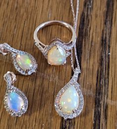 This stunning 4 piece set is a must-have for anyone who loves unique and beautiful jewelry. Crafted with care and attention to detail, this set includes a beautiful opal ring, earrings, and pendant. The oval-shaped opals are natural and have excellent cut grade, making them sparkle and shine in any light. The 14k rose gold metal adds a touch of elegance to this nature-themed set, which is perfect for any special occasion. With 21 diamonds to add extra sparkle, this set is sure to impress. Whether you're looking to add to your collection or give a special gift, this opal set is sure to please. I can get certificate if requested Jewelry Opal, Set Ring, Rose Gold Metal, Nature Themed, Opal Ring, Sparkle And Shine, Opal Jewelry, Opal Rings, Special Gift