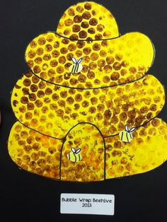 a piece of paper that has been cut out to look like a beehive