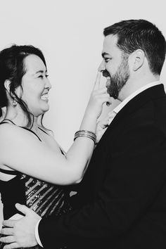 a man and woman dancing together in black and white