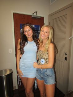 two beautiful young women standing next to each other