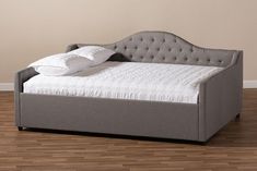 the bed is made up and ready for someone to use it in their home or office