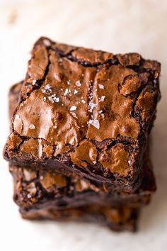 some brownies are stacked on top of each other