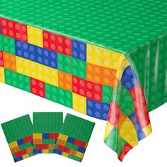 a table covered with lego blocks and place mats