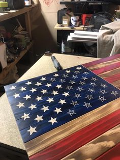 an american flag made out of wood sitting on top of a table