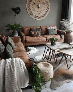 a living room filled with lots of furniture and decor