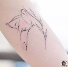 a woman's arm with a tattoo on it