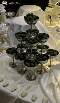 there is a display of olives on the table for guests to enjoy at their wedding reception