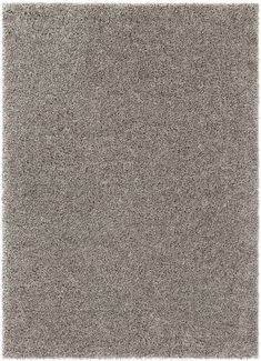 a gray rug with small white dots on the top and bottom corner, in an area that looks like it could be used as a carpet